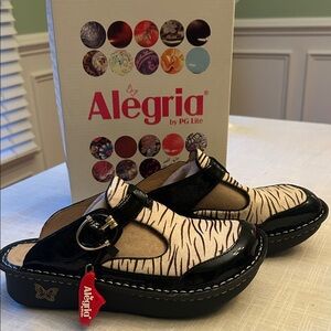 Alegria Zebra Patterned Mules with Black Glossy Accents